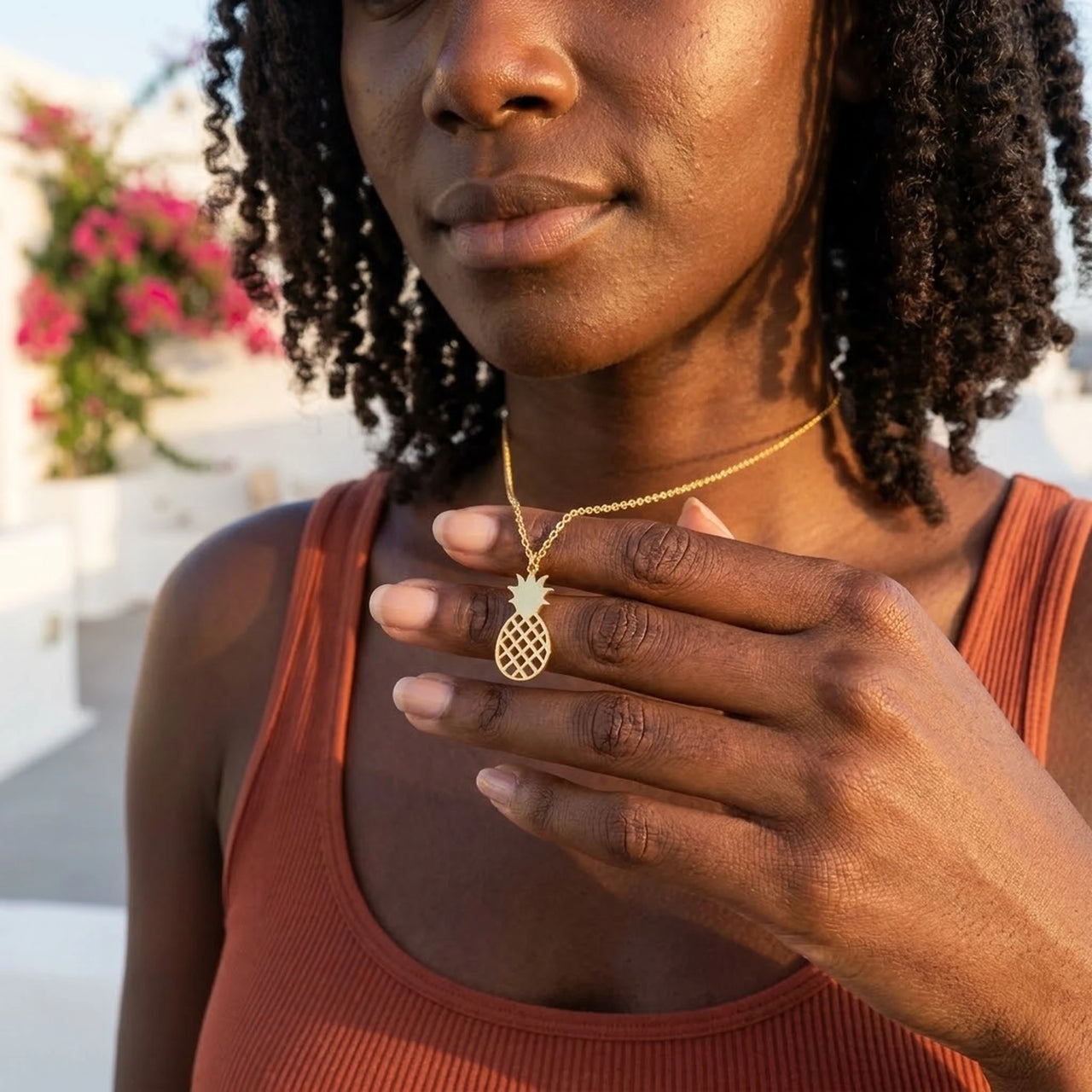Woman gently touching her gold necklace | SKU: 8050907-gold