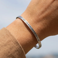 Thumbnail for Close-up of the Never Forget To Dream bracelet in silver worn | SKU: nftd-wg