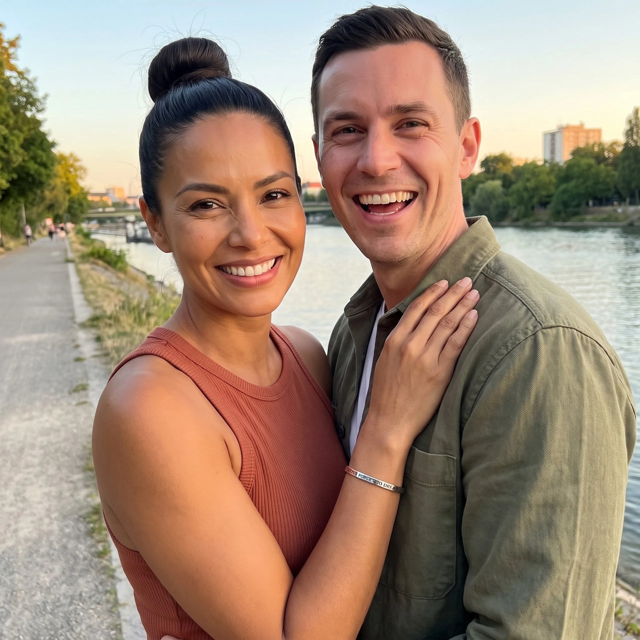Couple moment, she wears the Never Forget To Dream bracelet in silver | SKU: nftd-wg