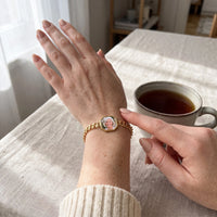 Thumbnail for Warming the gold octagon photo bracelet with a thumb, her mother's photo appears | SKU: TPH-OCTB-GOLD-18
